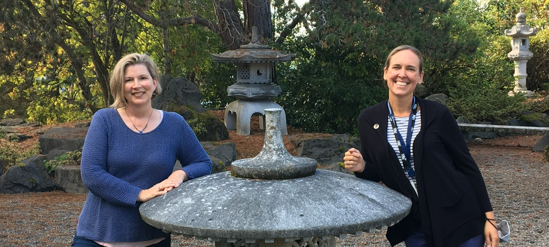 Alisa Ulferts Birkenstein and Michelle Butler, women standing in the TCC Japanese Garden